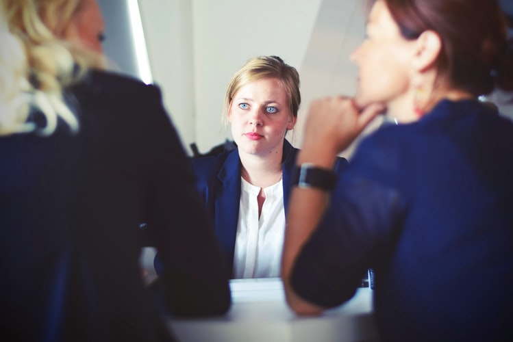 Three business woman talking