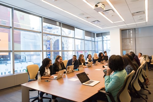 Meeting taking place round large table