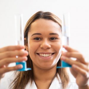 Student holding two test tubes