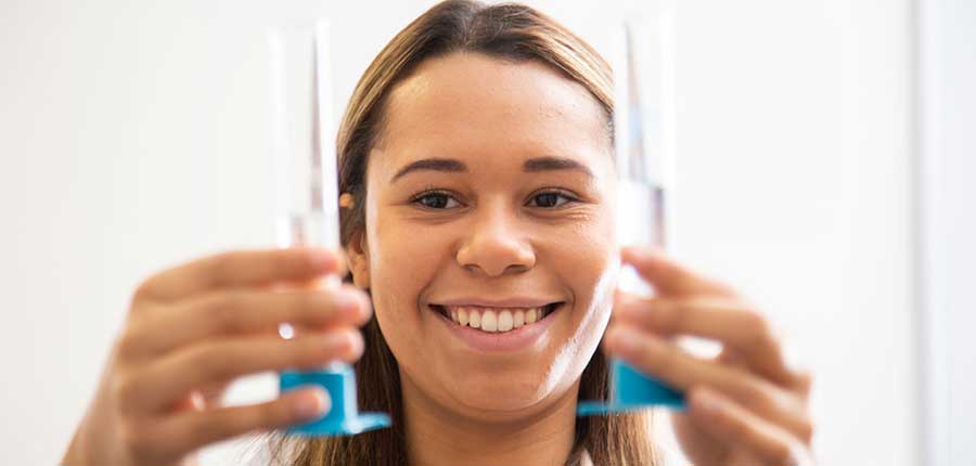 Student holding test tubes