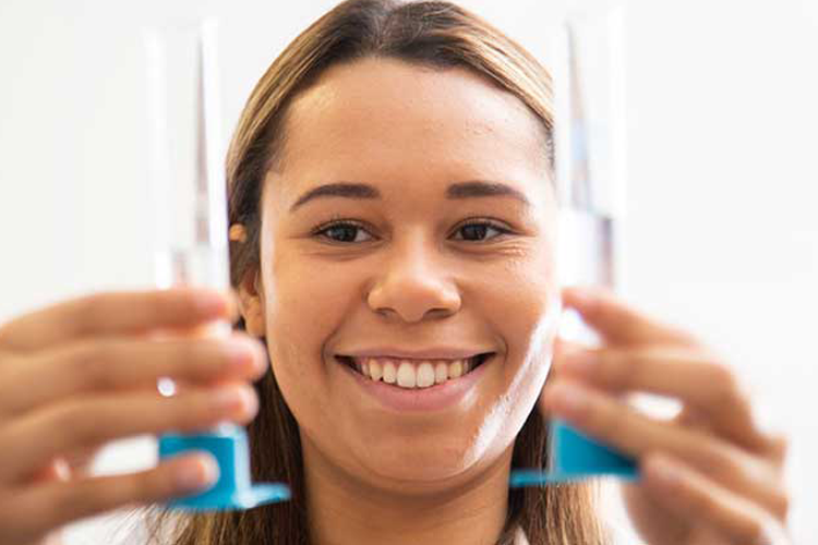 Student holding test tubes