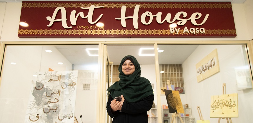 Aqsa Yaqoob in front of her shop, Art House