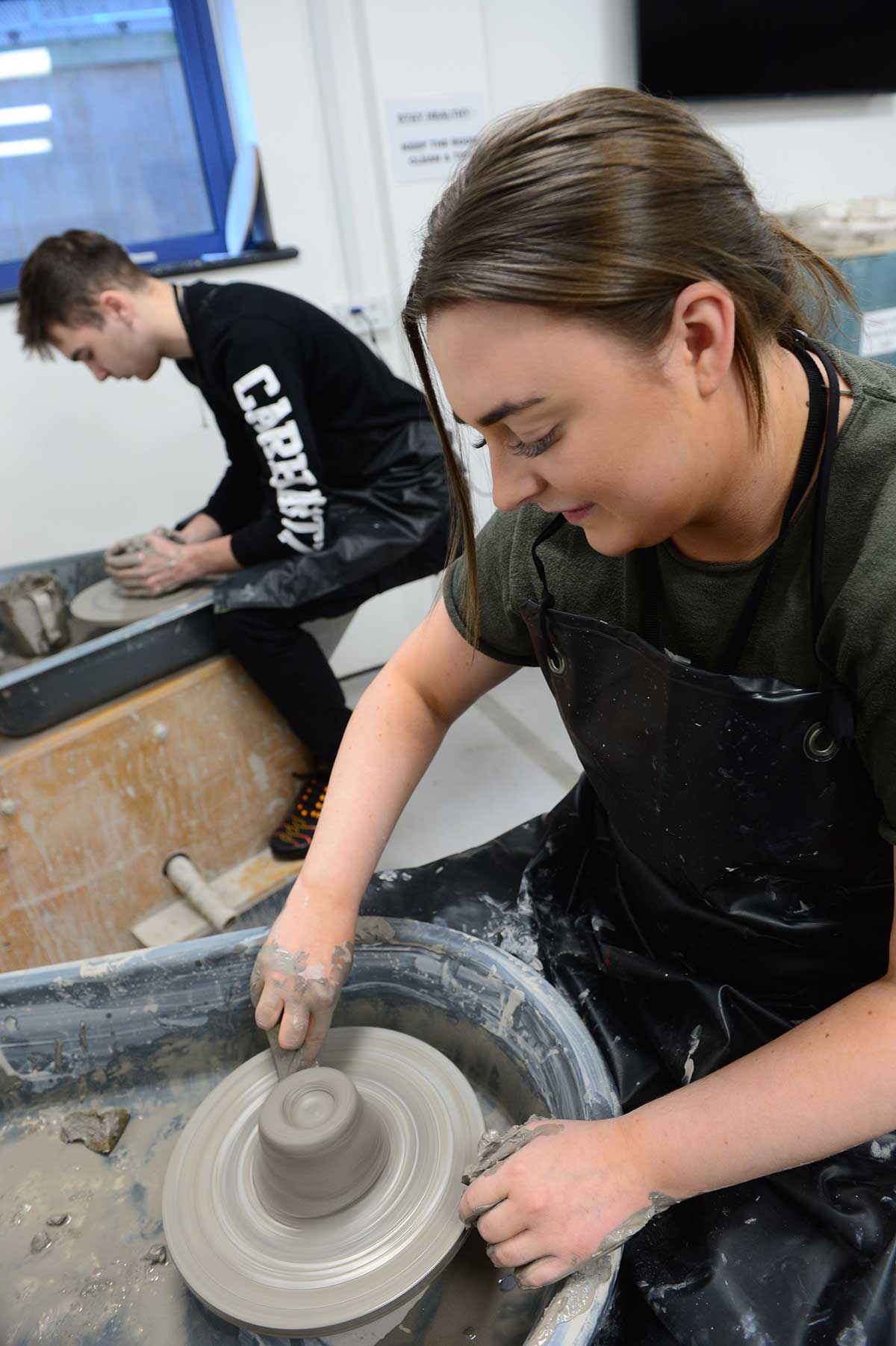 Student working with clay