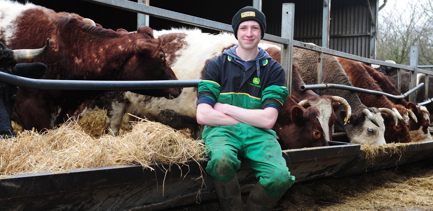 Ashley Slater sat by some cows