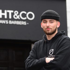 Brad Knight outside of his barber shop, Knight & Co