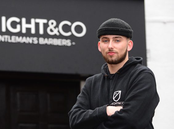 Brad Knight outside of his barber shop, Knight & Co