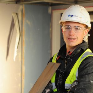 Brad Peters plastering a wall