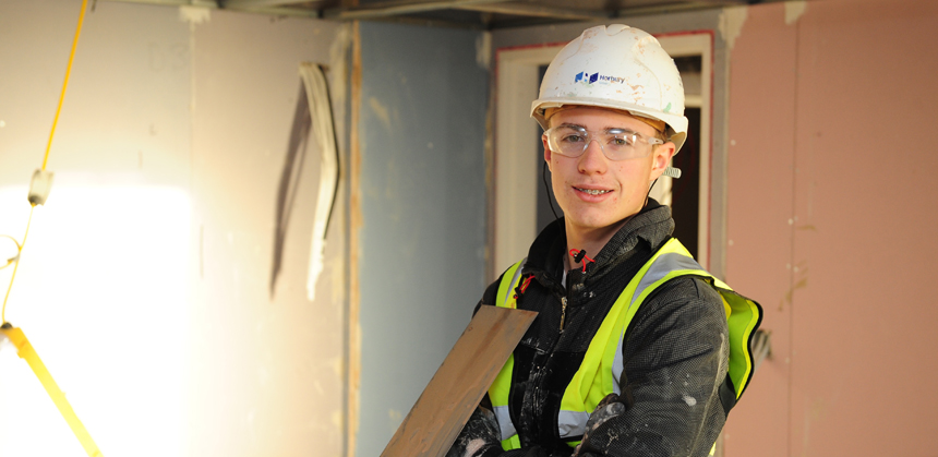 Brad Peters plastering a wall