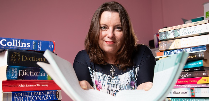 Catherine Connolly with a pile of books