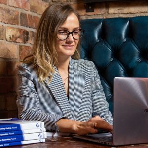 Diana typing on a laptop computer