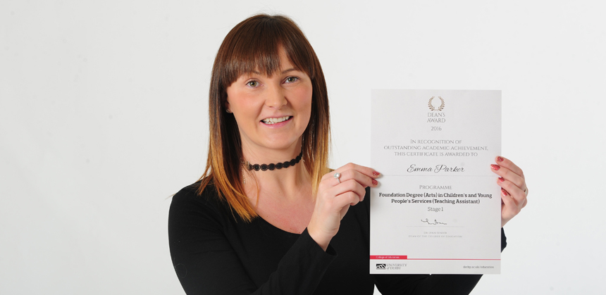 Emma Parker holding her award