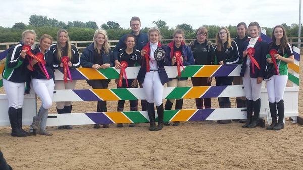 Equine students holding their medals