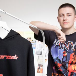 Hadley Trueman leaning on a clothes rack