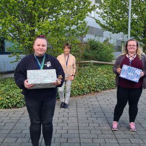 Health & Social Care students holding memory boxes