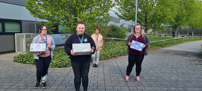 Health & Social Care students holding memory boxes