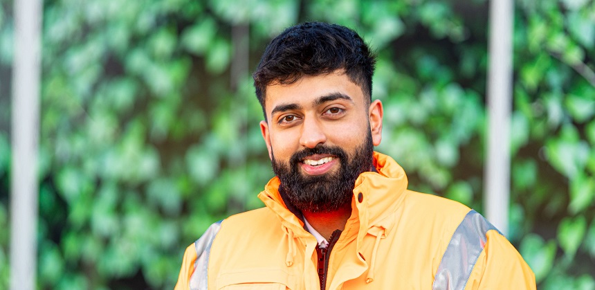 Jason Singh wearing a hi-vis vest whilst on site