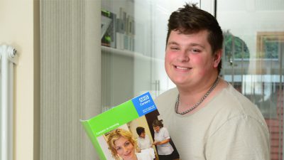 Lewis Morrell reading a book