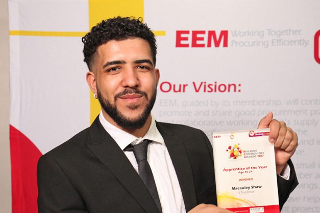 Macauley Shaw holding his award