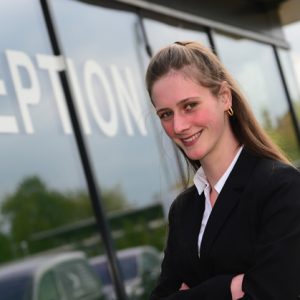 Monique stood outside of Derby College reception