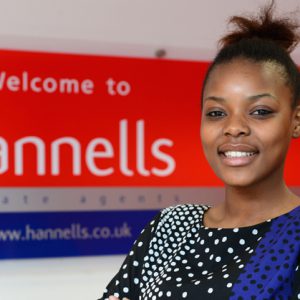 Rufaro stood by a Hannells sign