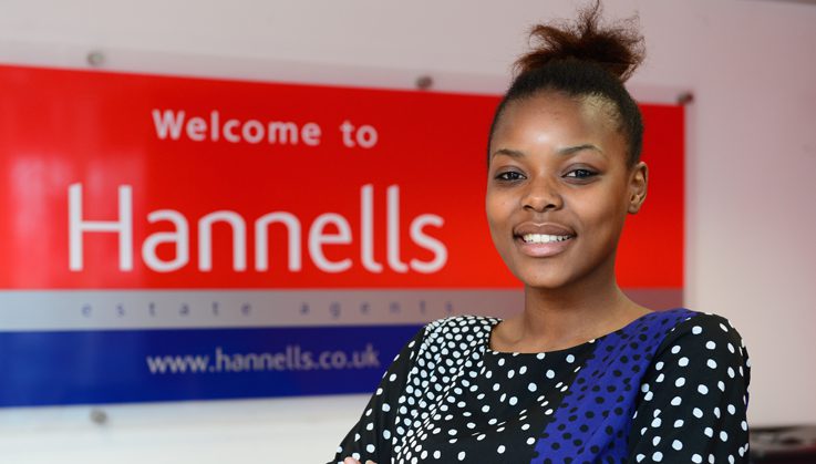 Rufaro stood by a Hannells sign