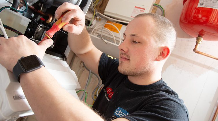 Ryan Pearch working on a boiler