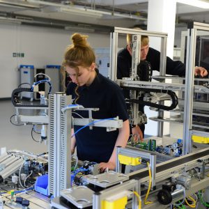 Girl student using the mechatronics laboratory