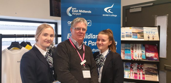 Travel and Tourism students and their teacher at the information event