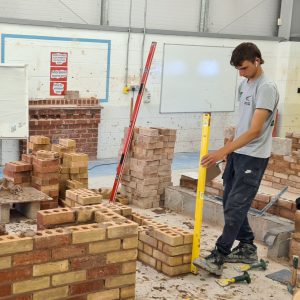 Bricklaying students at the Hudson building