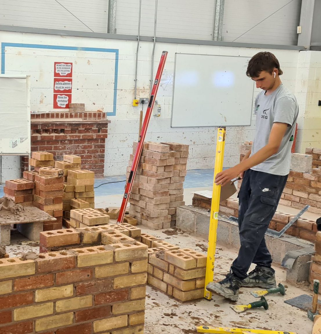 Bricklaying students at the Hudson building