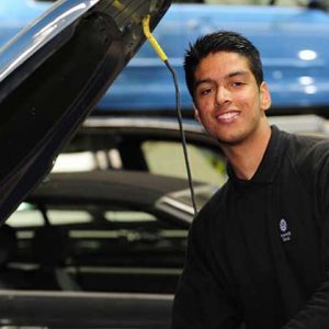 Sukjevan Dhindsa working on a car