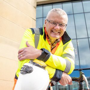 Clive Sayers holding a helmet outside of Derby City Council Hall