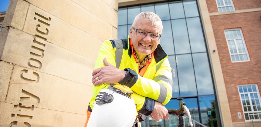 Clive Sayers holding a helmet outside of Derby City Council Hall