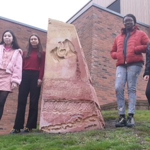 Students stood by the obelisk in Ilkeston