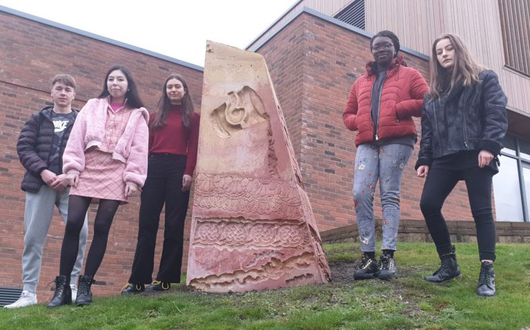 Students stood by the obelisk in Ilkeston