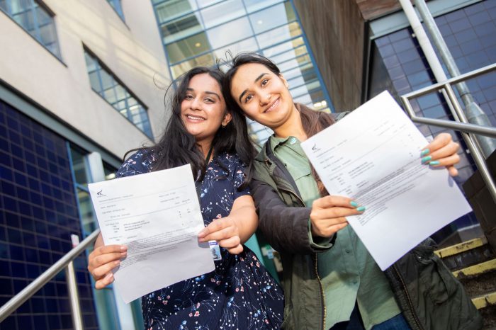 Jaiya Verma and Yousra Jamal holding their results