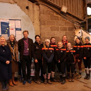 Lord Burlington with a group of Equine students and a horse