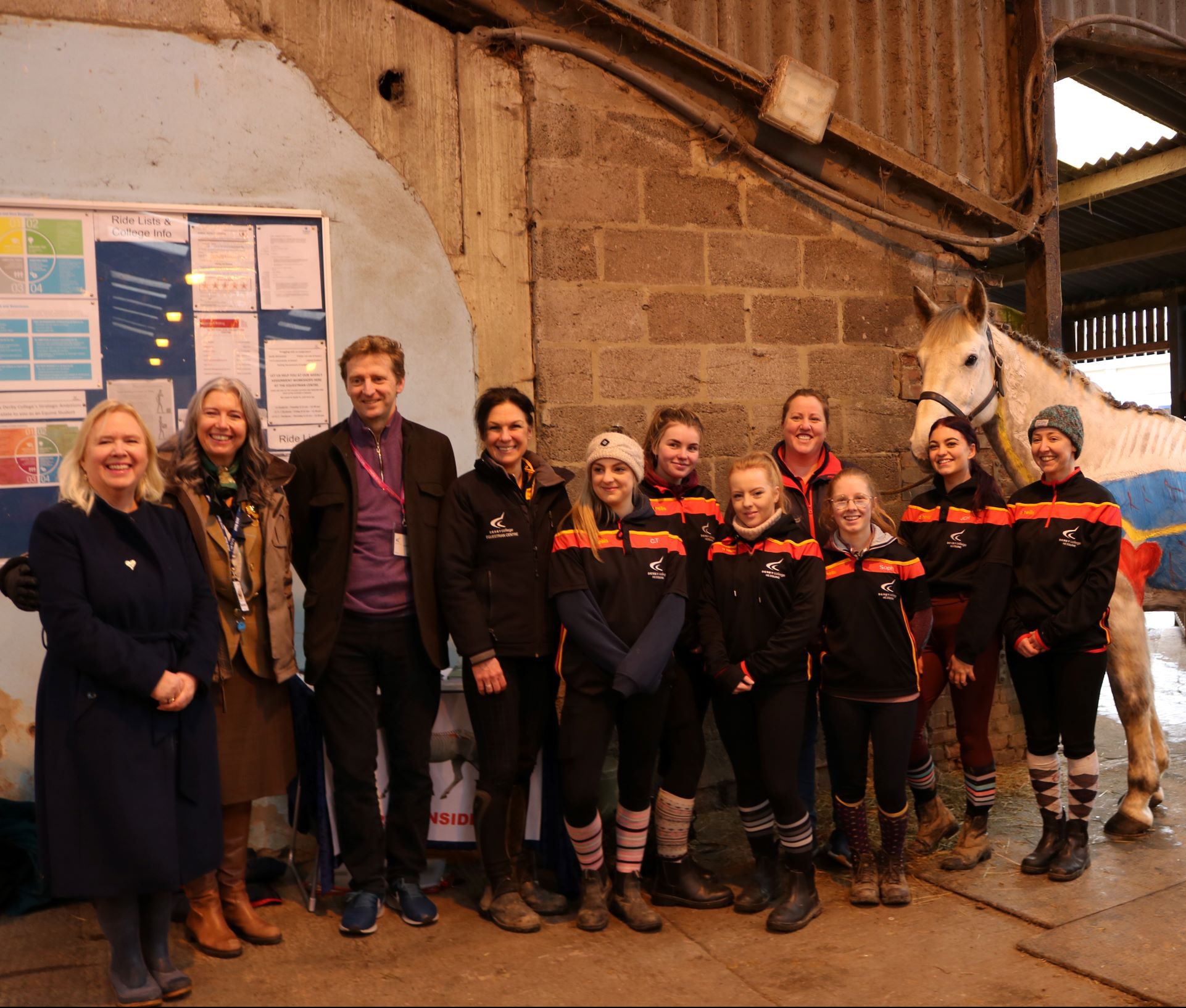 Lord Burlington with a group of Equine students and a horse