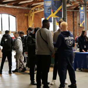 Students talking to employers at the Insight Into Industry event at the Roundhouse