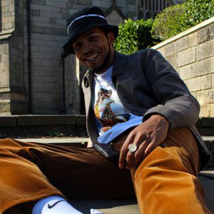 Grime rap star Eyez sat on steps outside