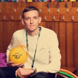 Padraig Finnan holding a ball at school