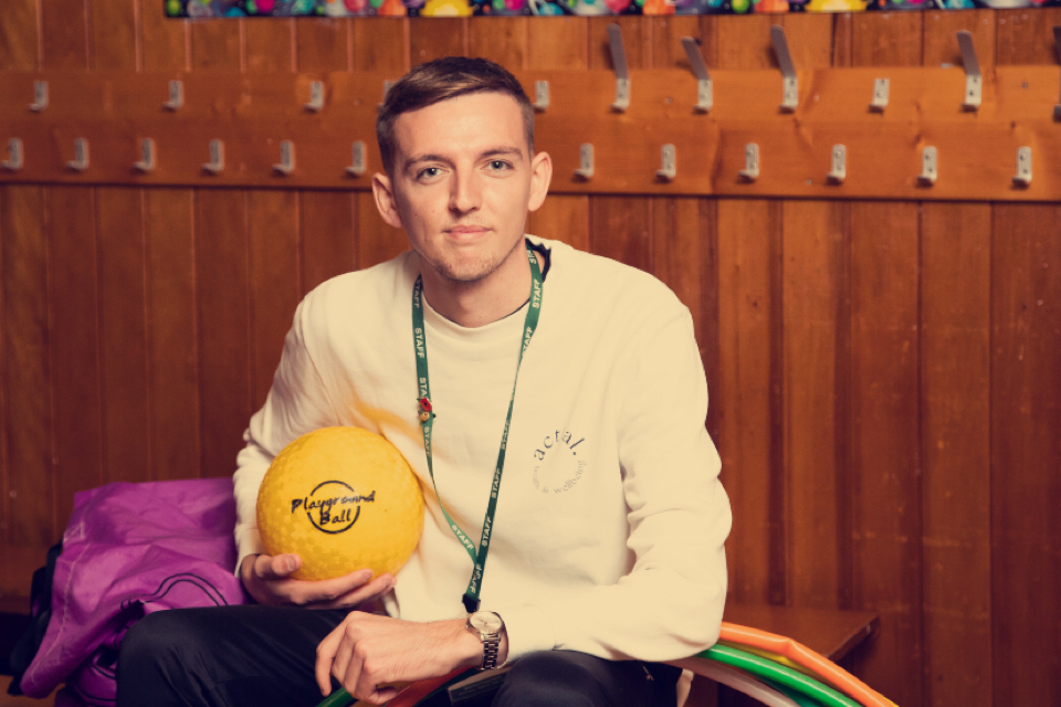 Padraig Finnan holding a ball at school