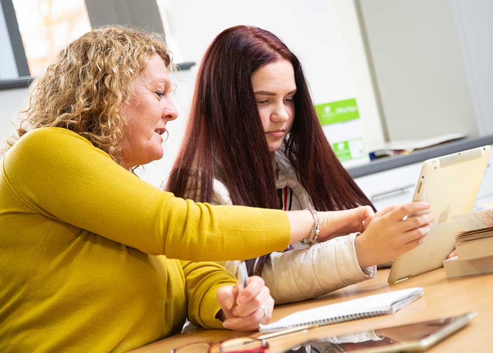 student in library