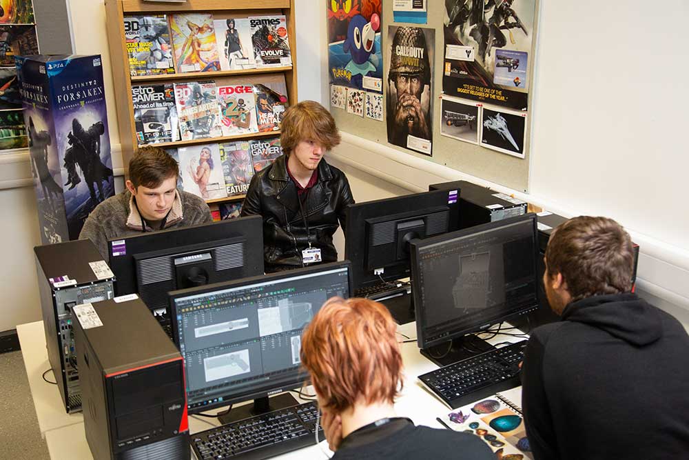 student standing in front of call of duty poster