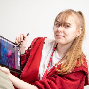 Former Games Development student Lauren Taylor using a tablet.