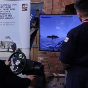 Student using a Royal Navy virtual reality game machine.