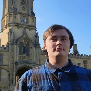 Uther Naysmith stood outside of Oxford University.