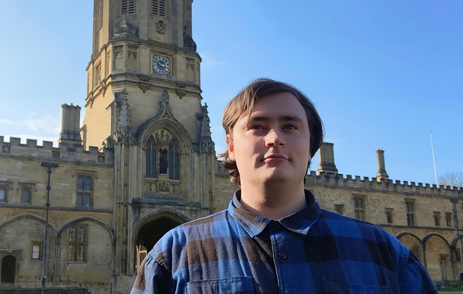 Uther Naysmith stood outside of Oxford University.