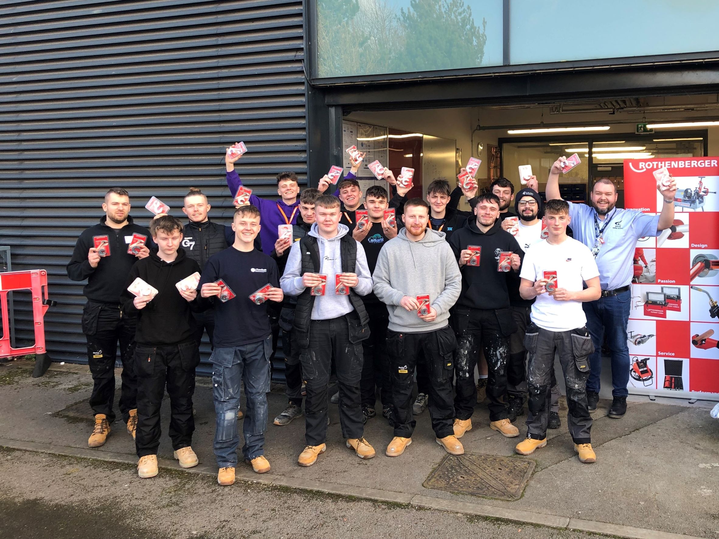 First year Rothenberger apprentices holding tools.