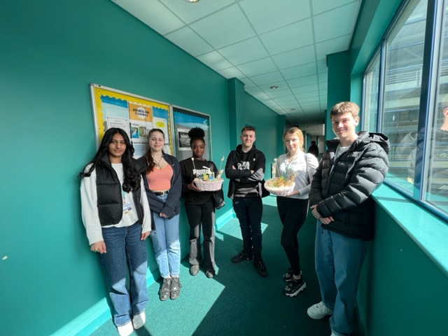 The Sugar Rush team holding their products at the Joseph Wright Centre.